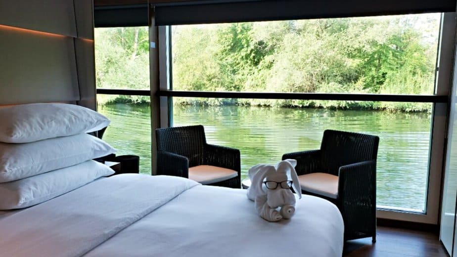 River boat cabin interior with a view of the shore