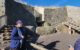 A docent outside Newgrange passage tomb