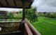 A hotel terrace overlooking a rice field