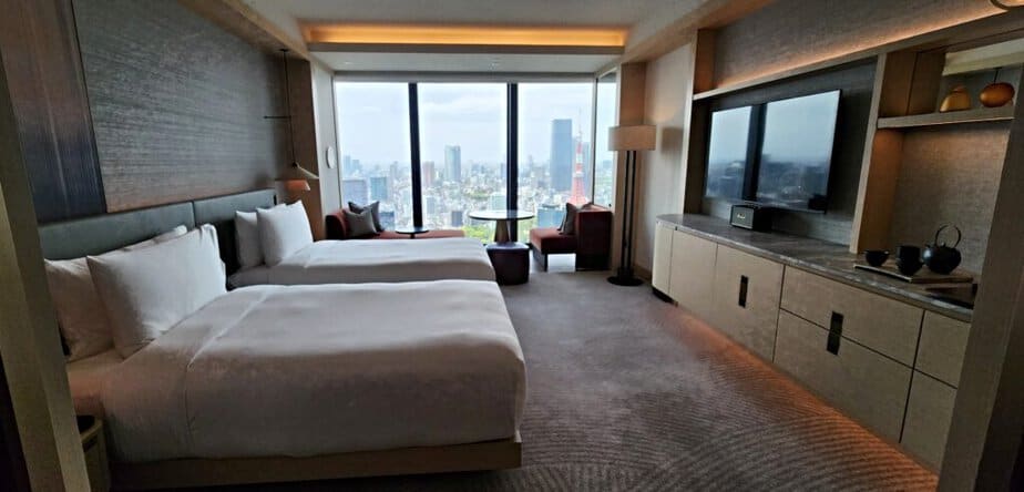 Hotels like this one that are high above street level are quieter than ones in busy areas. Photo of hotel room with a panoramic view of Tokyo
